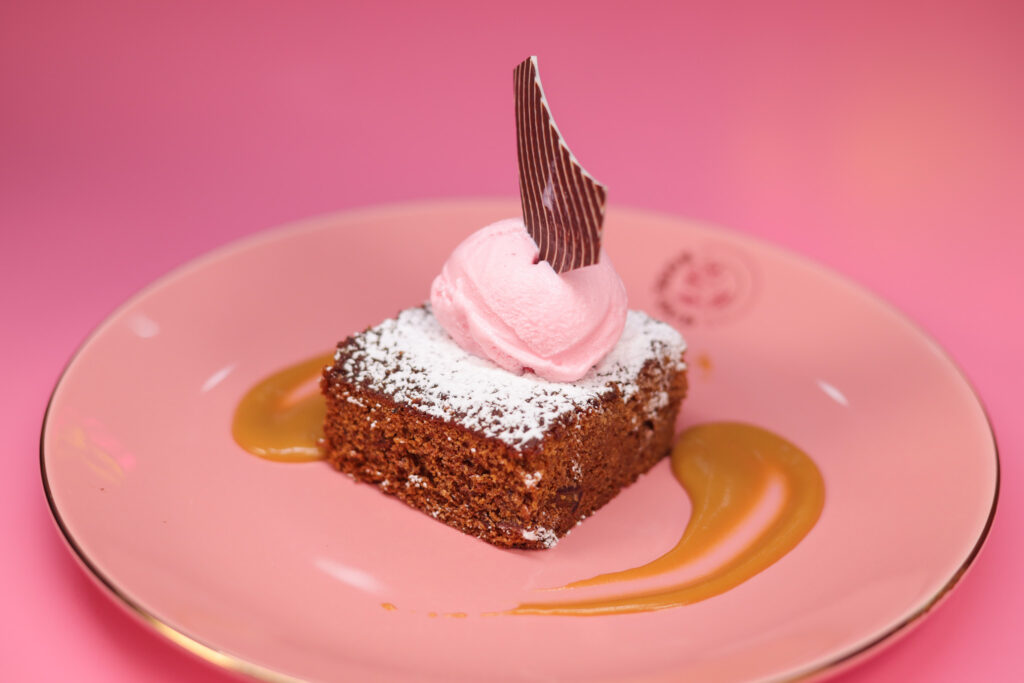 Signature dessert plate with layered cake and oud-flavoured cream