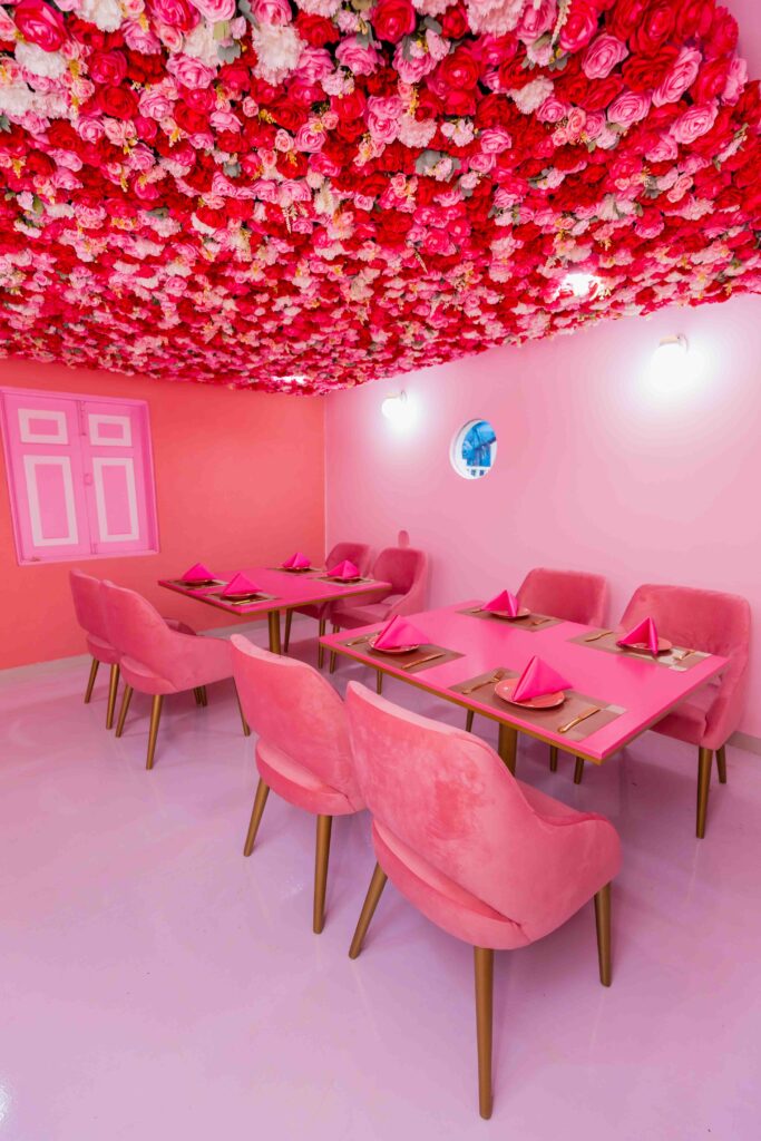 Guests enjoying the rose and oud atmosphere inside Rose Oud Café