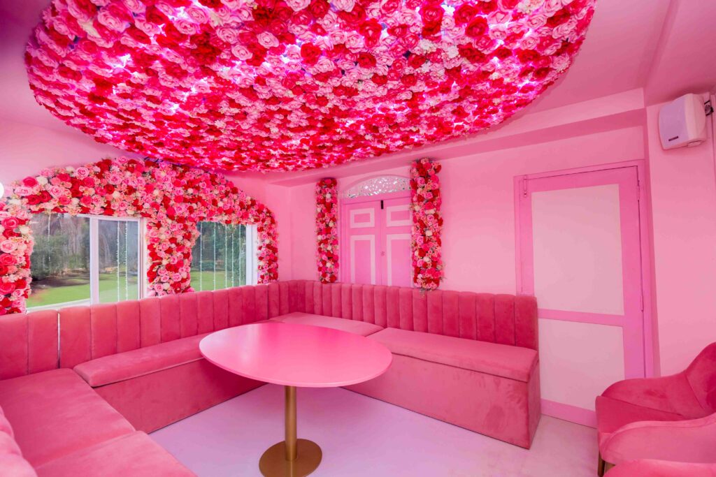 Rose Oud Café lounge area with plush seating and rose arrangements
