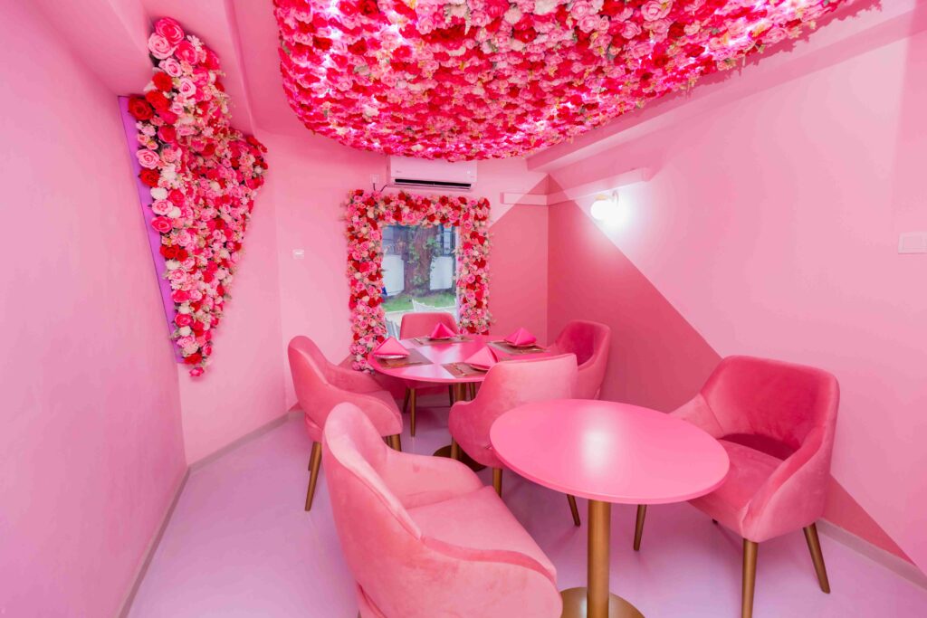Luxury café ambiance blending rose petals and oud-scented candles