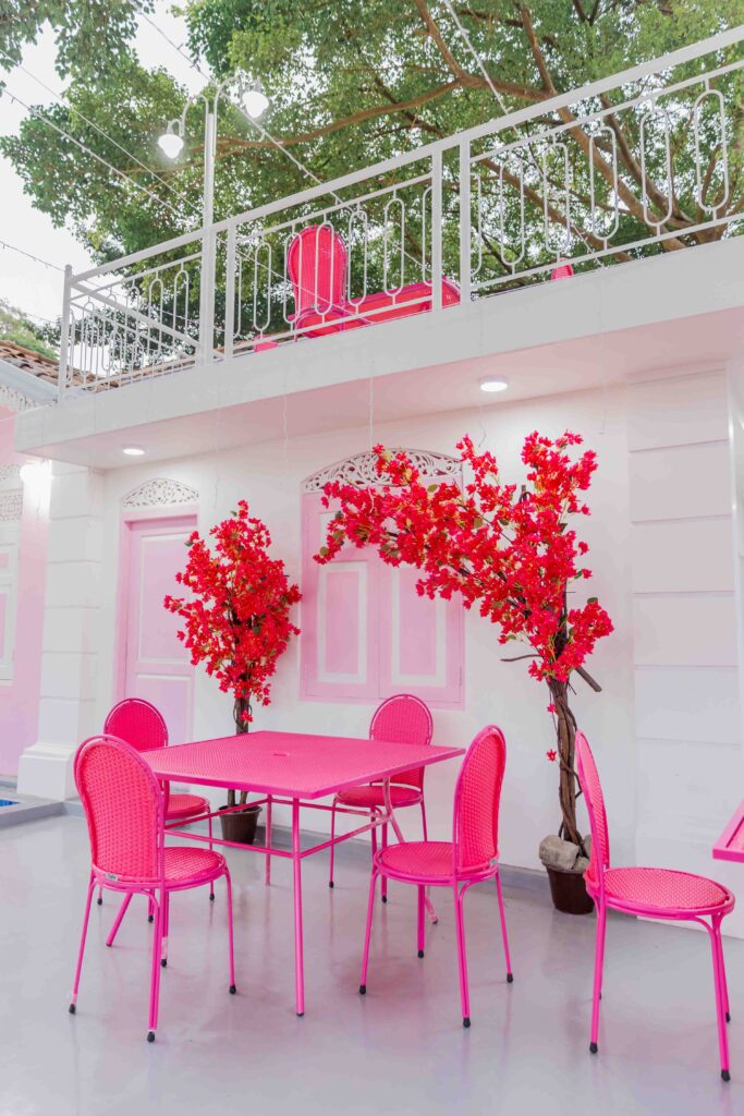 Elegant café exterior featuring rose and oud design elements